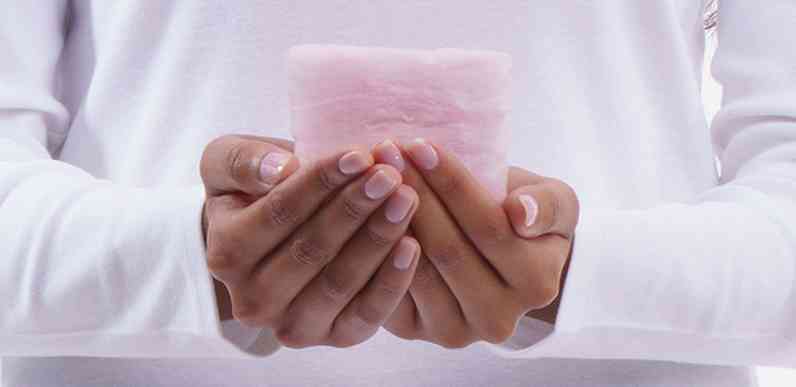 closeup photo of hands on insulation during installation