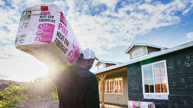 Rolls of Insulation sitting outside a new house