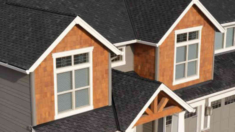 Photo of a house with dark Woodmoor®/Woodcrest® Shingles on the roof