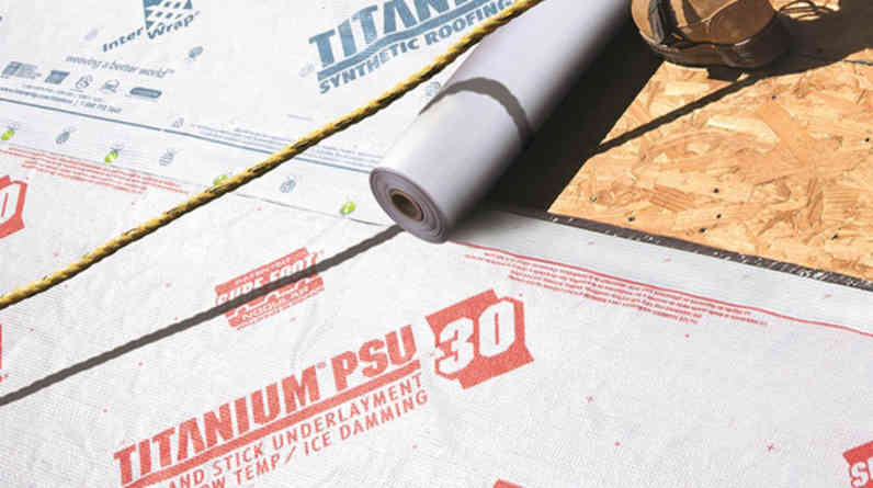Closeup of contractor on roof installing Titanium® PSU30 Self-Adhered Underlayment