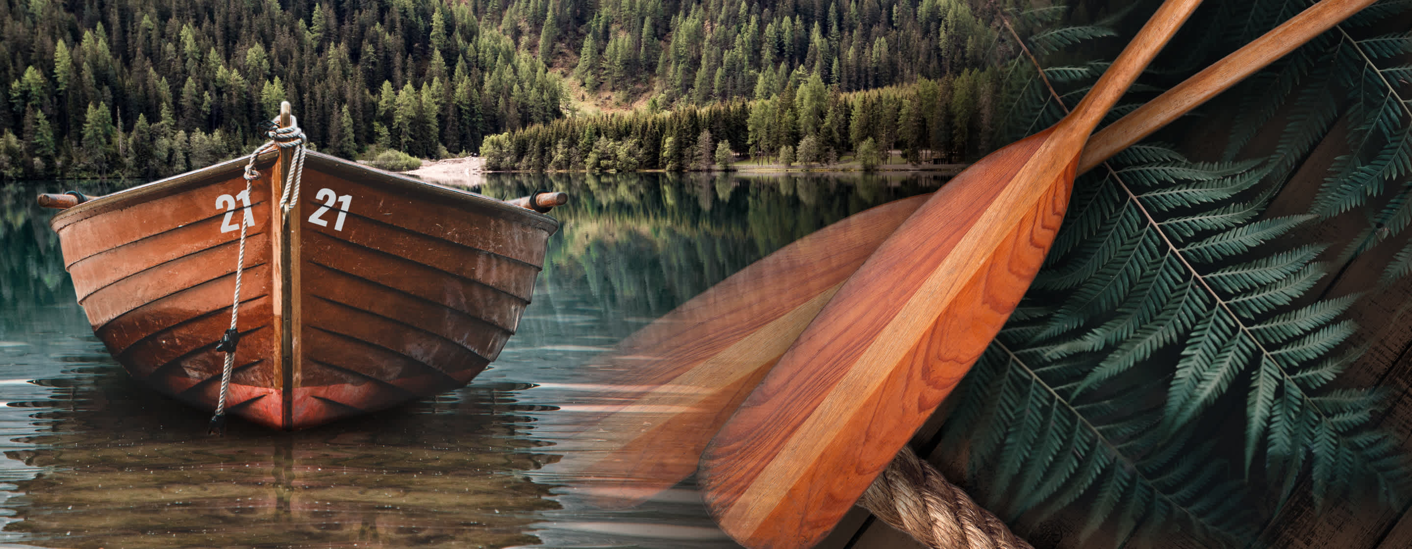 Montage image with a wooden boat in a lake with a scenic wooded landscape behind. Wooden oars and deep green furs also composited for a very earthy, nature-inspired visual.