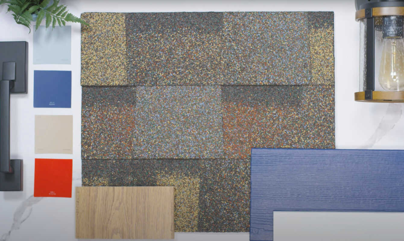 Shingle swatch surrounded by paint swatch squares, wood samples, and black hardware.