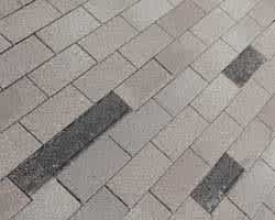 roof with missing 3-tab asphalt shingles