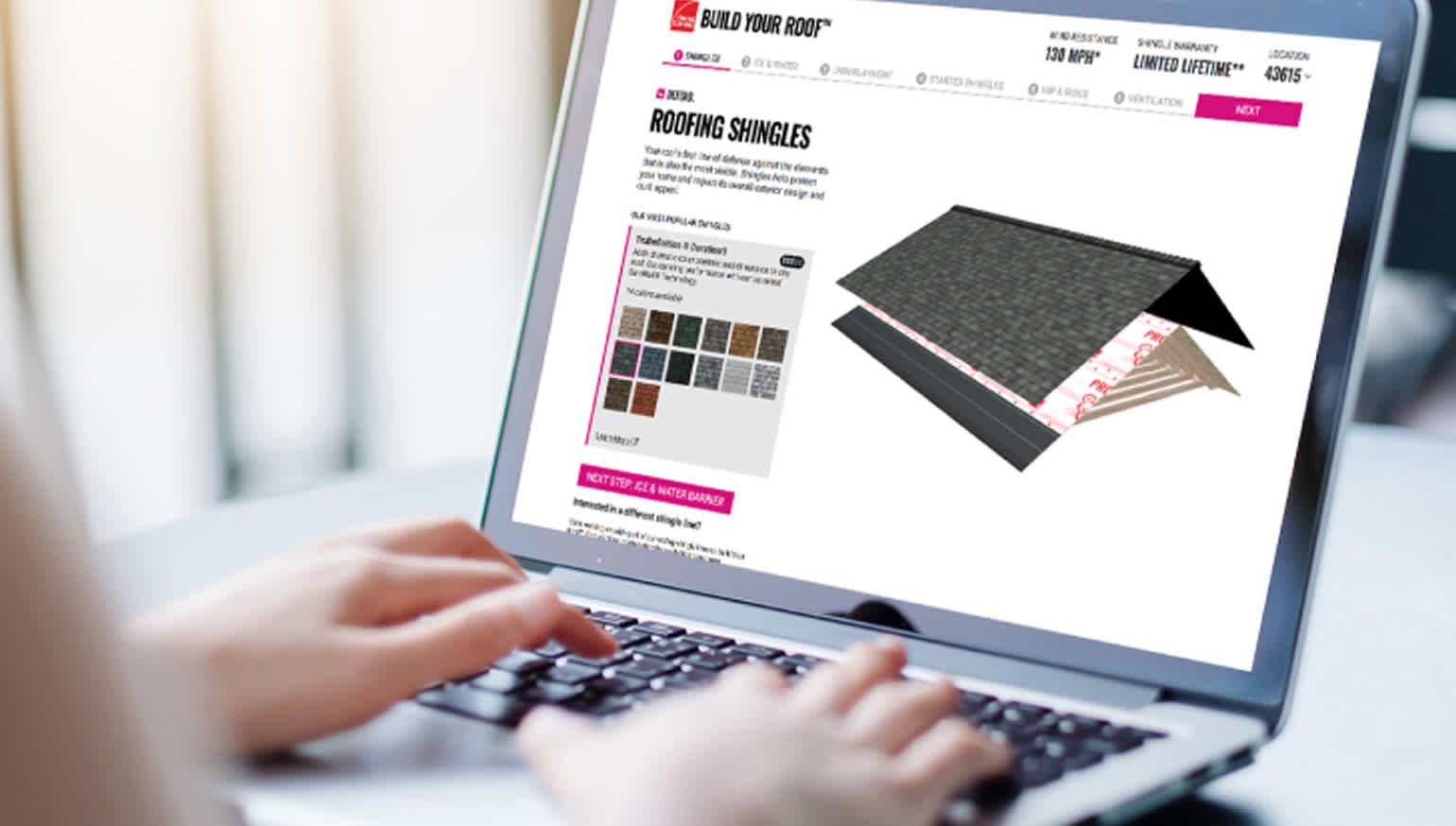 Person typing on a laptop using the Owens Corning Build Your Roof tool.