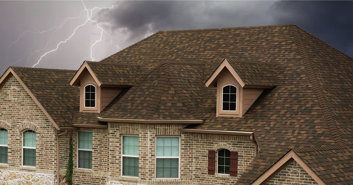 TruDefinition® Duration FLEX® shown in the color Brownwood, a Class 4, Impact-Resistant SBS roofing shingle from Owens Corning Roofing