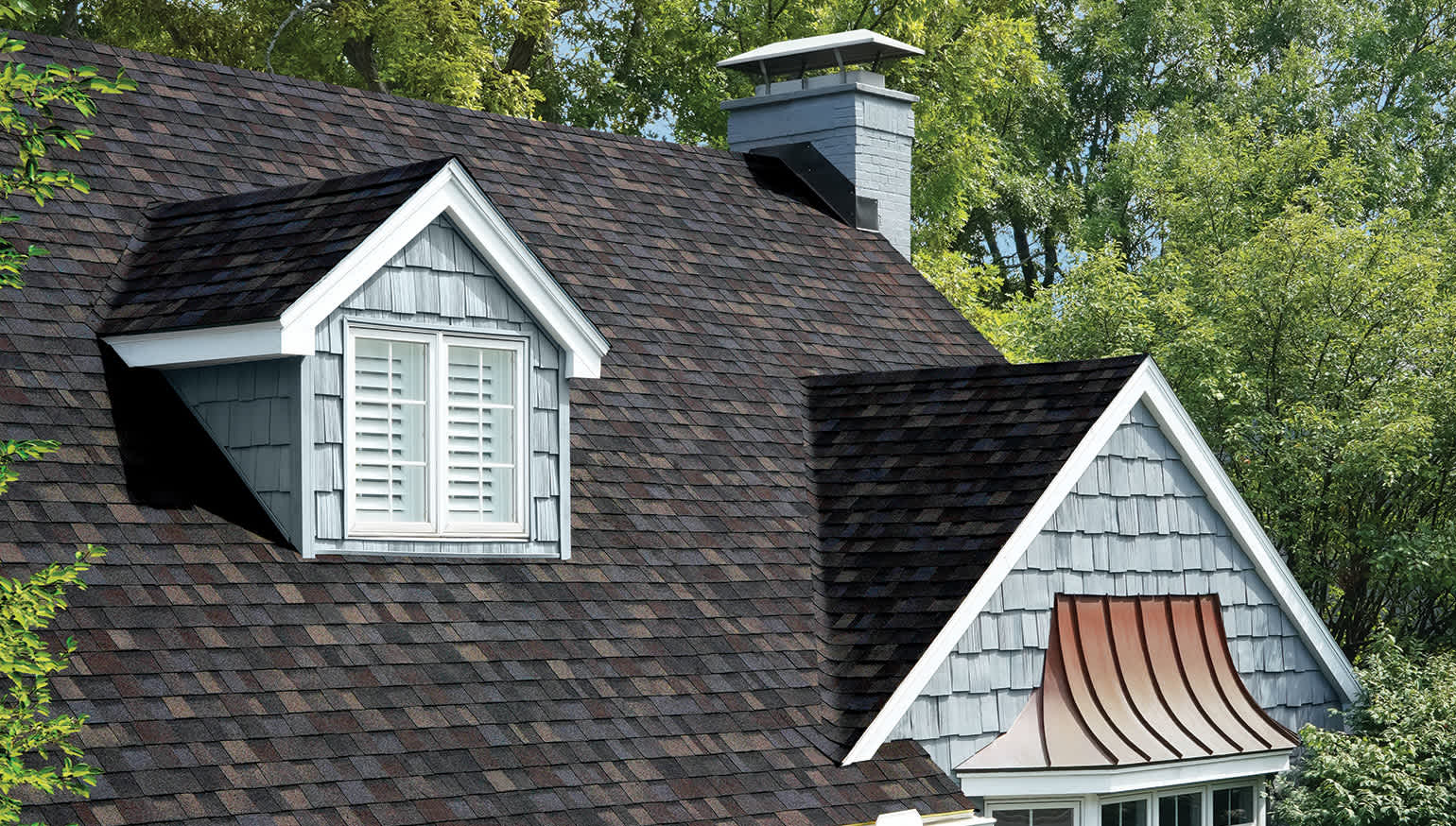 Copper accents complement this TruDefinition® Duration Designer roof in the color Black Sable