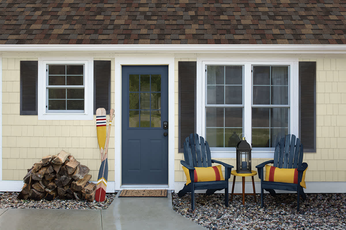 Yellow house with TruDefintion® Duration® Designer Shingles in the color Summer Harvest