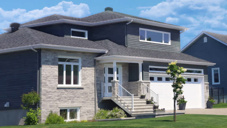 House with gray exterior, including siding and shingles