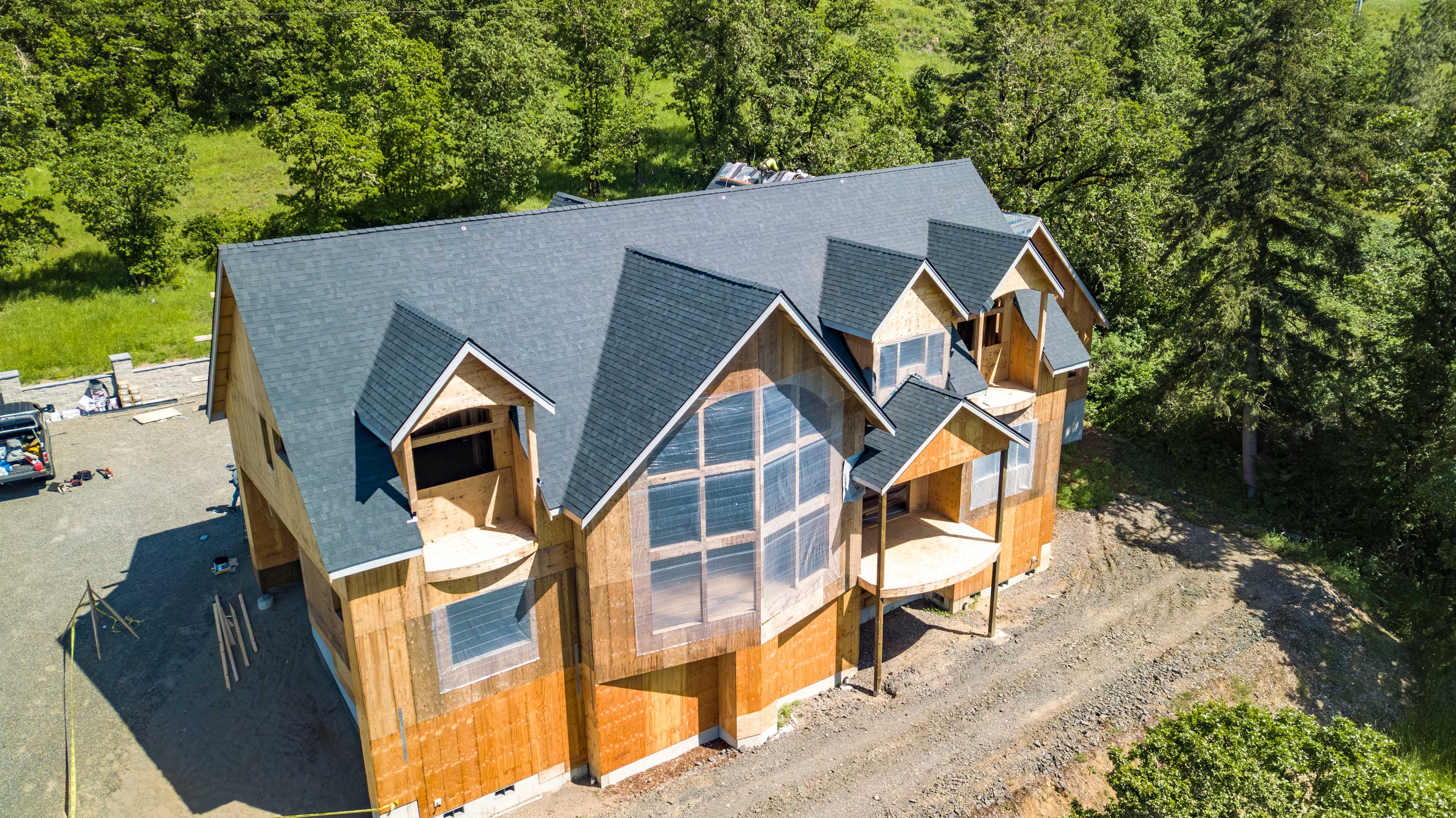A partially finished new construction home with Onyx Black Duration shingles from Owens Corning