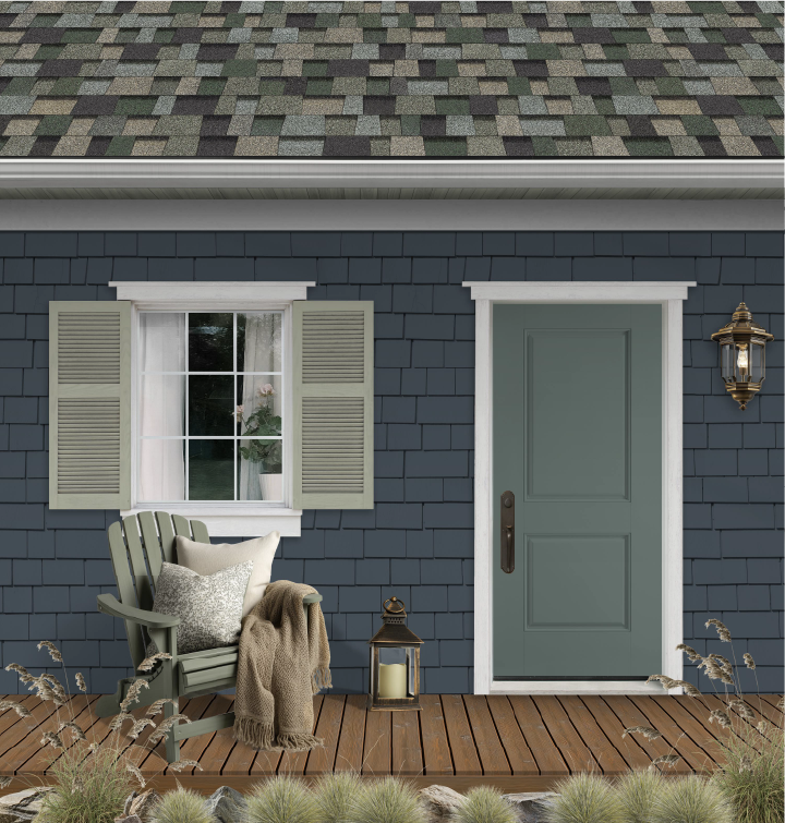 Porch in front of a blue sided home with different shades of green exterior elements and Evergreen Mist shingles from Owens Corning.