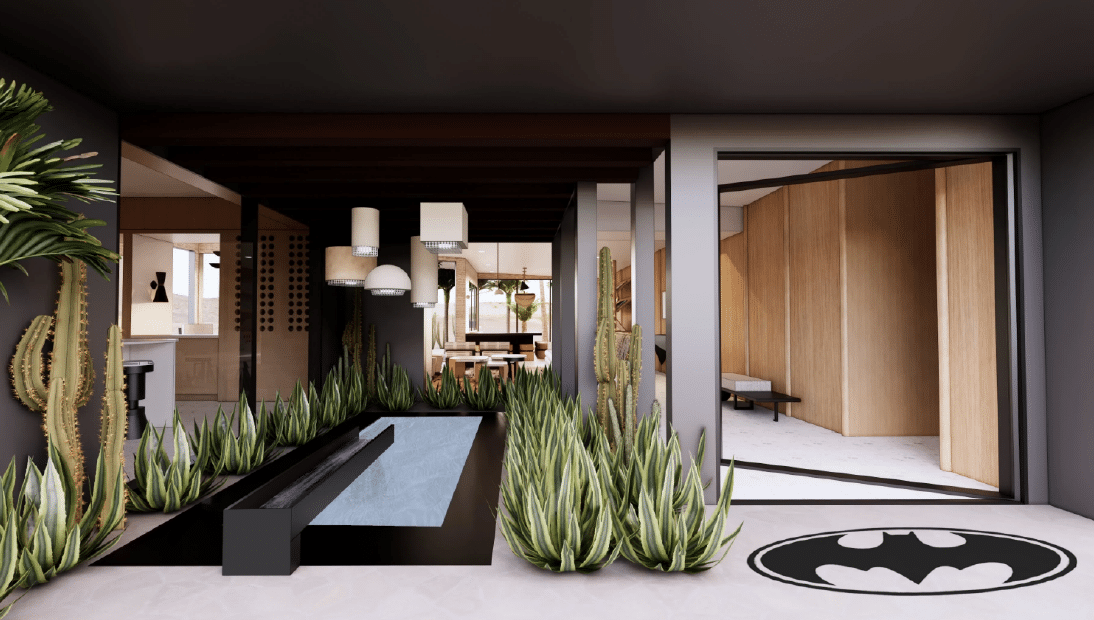Modern interior courtyard featuring a sleek black reflecting pool surrounded by tall green succulents and cacti, with pendant lighting overhead and open-concept spaces showcasing natural wood walls and minimalist design.