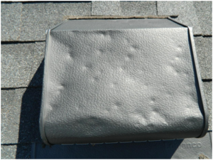 Roof box vent with hail damage