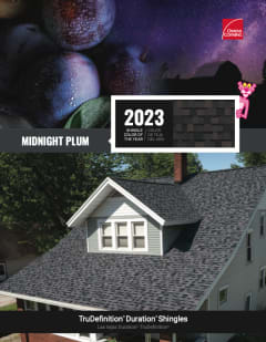 A two story house with Midnight Plum colored roof