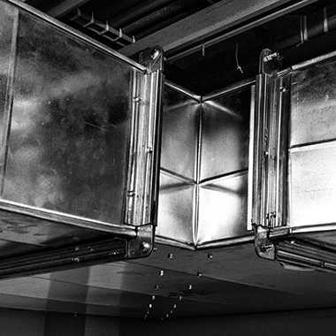 Metal HVAC system joint corner in the ceiling.