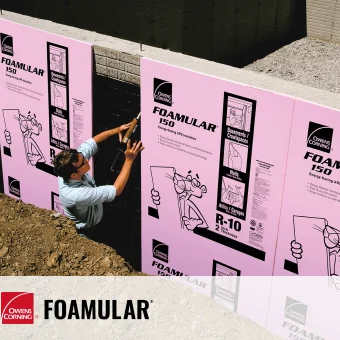 A man installing pink xps insulation 
