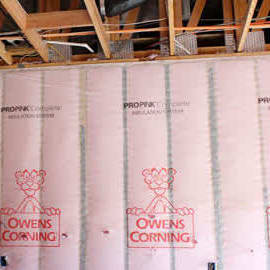 owens corning pink insulation in an exposed wall cavity