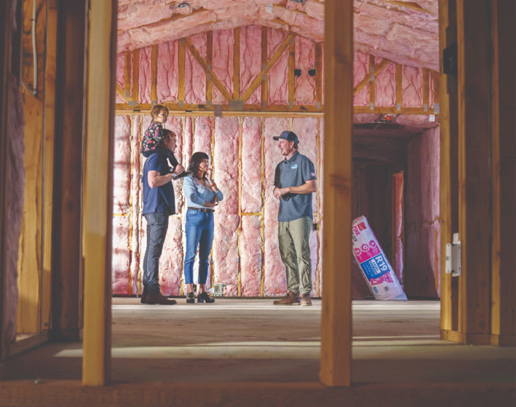 Photo of family speaking to contractor