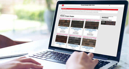 person using a laptop to order a shingle color poster