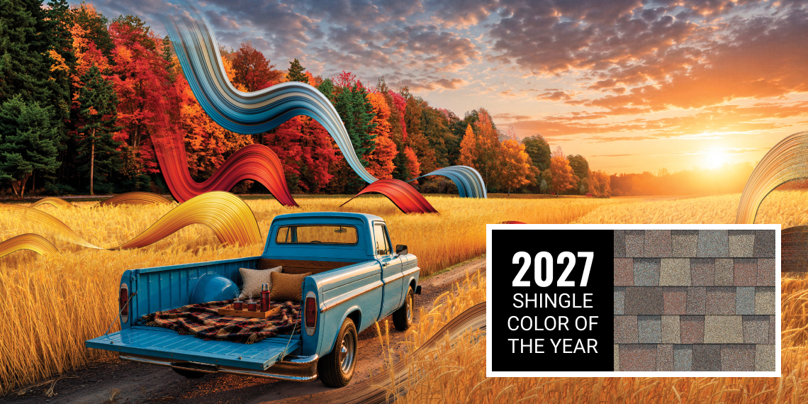 A scene of a bright blue truck driving through a golden field on a dirt road with fall trees, set beside Owens Corning 2027 Shingle Color of the Year, Summer Harvest