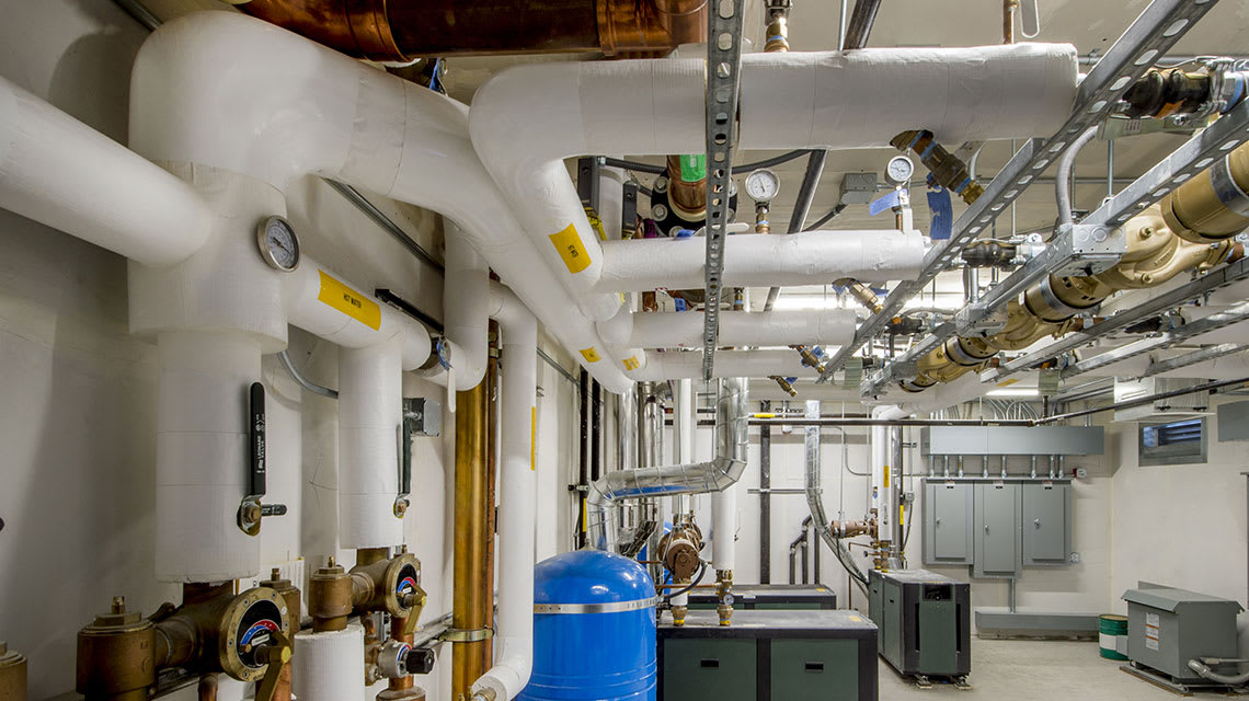 mechanical pipe insulation and equipment in industrial setting