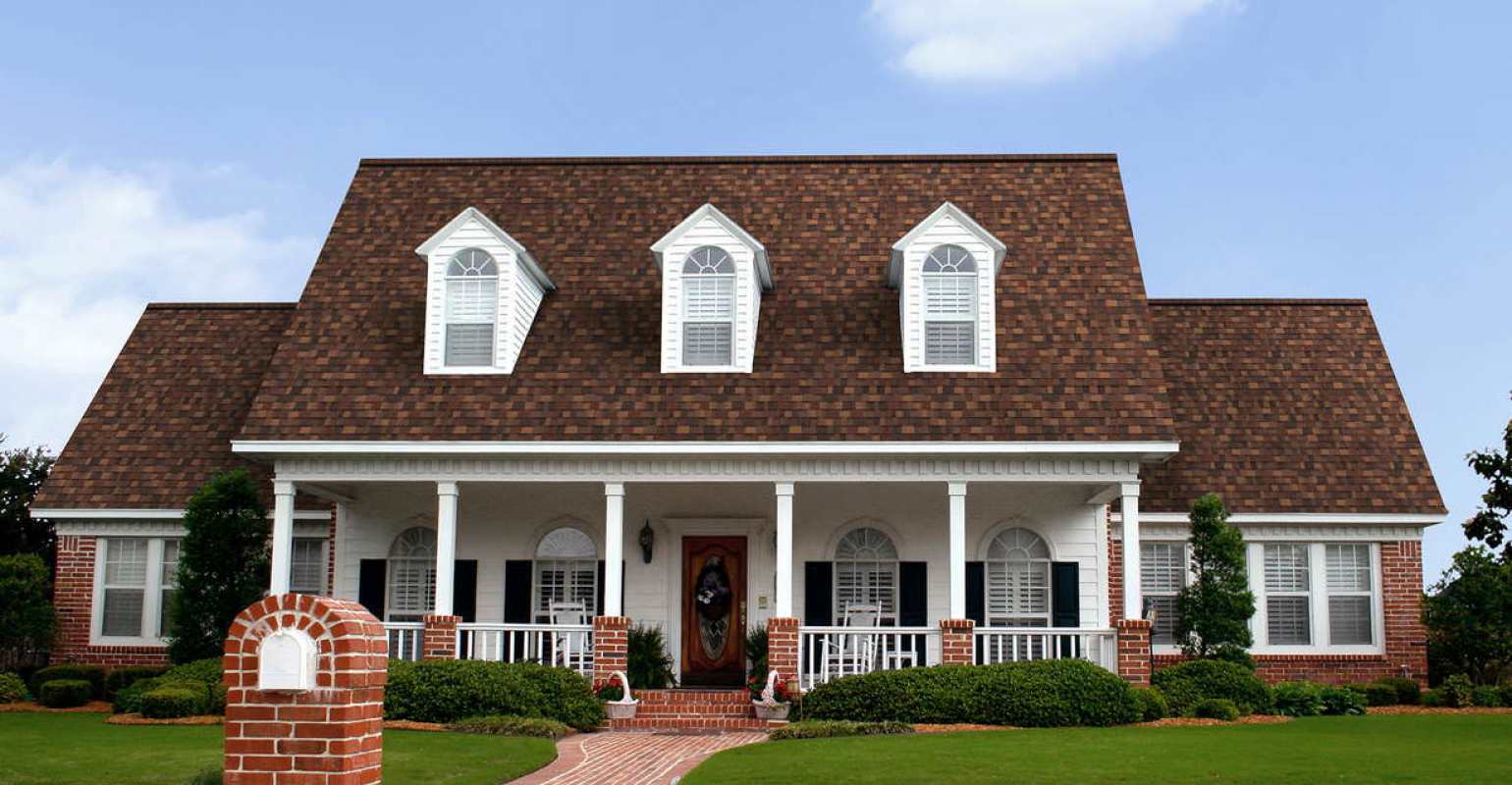 White and red brick house with Sedona Canyon roof.