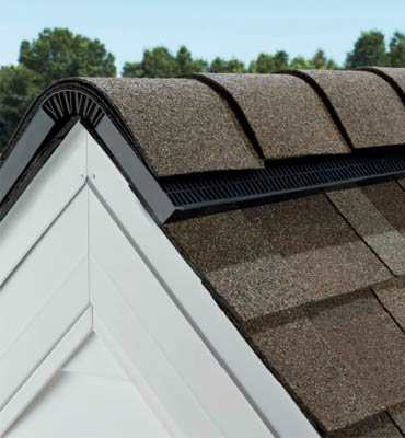 Photo of the peak of a roof with VentSure® 4-Foot Strip Heat & Moisture Ridge Vent installed