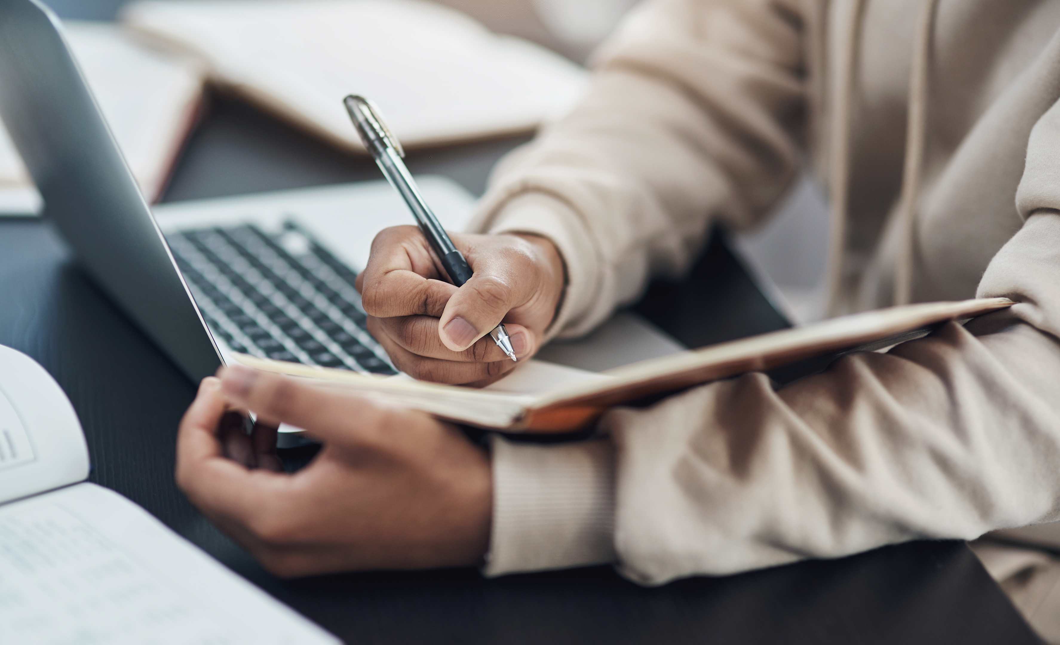 Photo of Man Writing in Journal