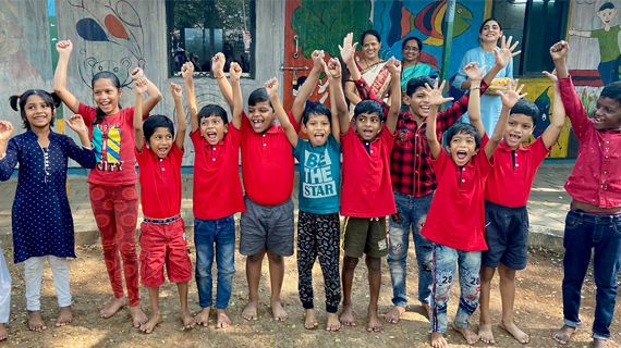 Small children with arms up in excitement