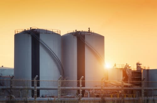 Two high temperature storage tanks at sunset