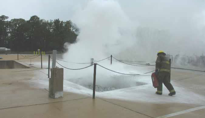 Smoky LNG pool that has just had a fire extinguished