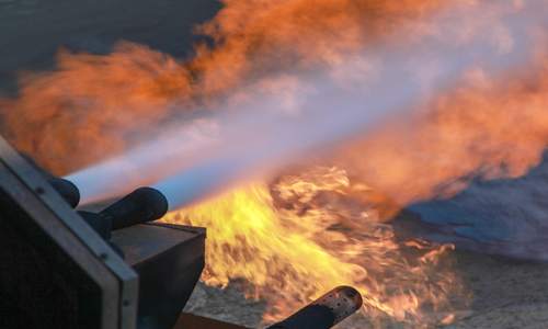 Water jets extinguishing flames