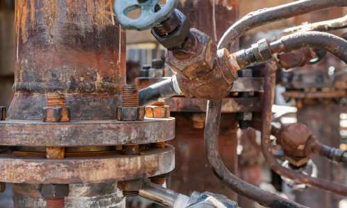 Metal piping showing signs of rust and corrosion