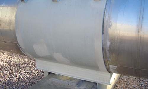 Pipe support showing beginning signs of corrosion.