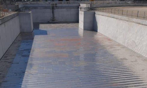 Exterior image looking in at an LNG basin