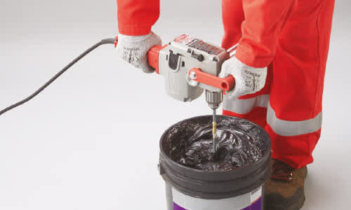 Photo of someone mixing adhesive