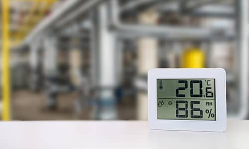 Photo of a digital thermometer showing high humidity levels