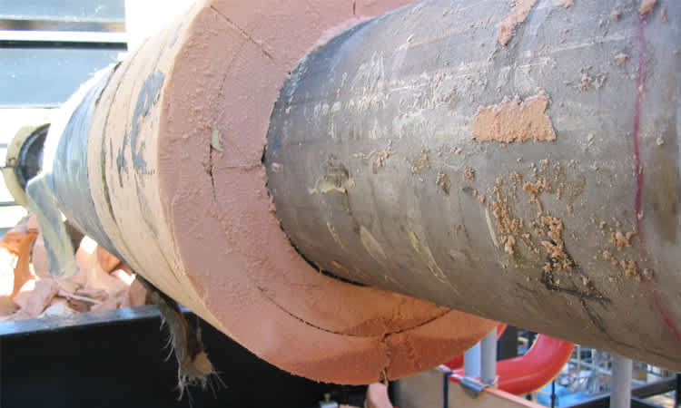 Moisture accumulation in PU foam system due to breach in vapor barrier.