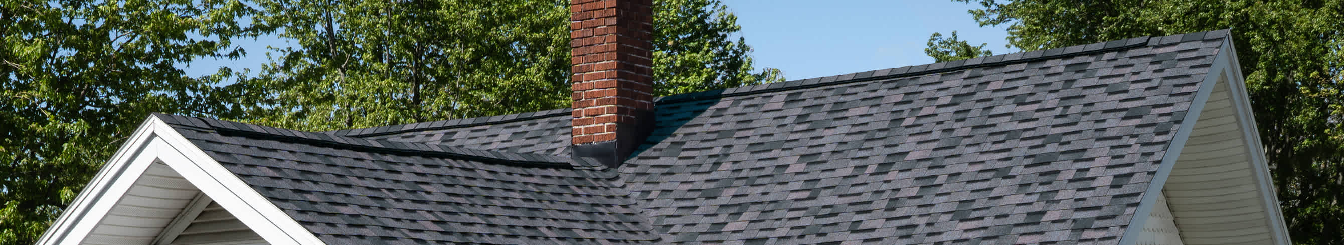 Close up view of roof line with Midnight Plum shingles from Owens Corning Duration shingle line