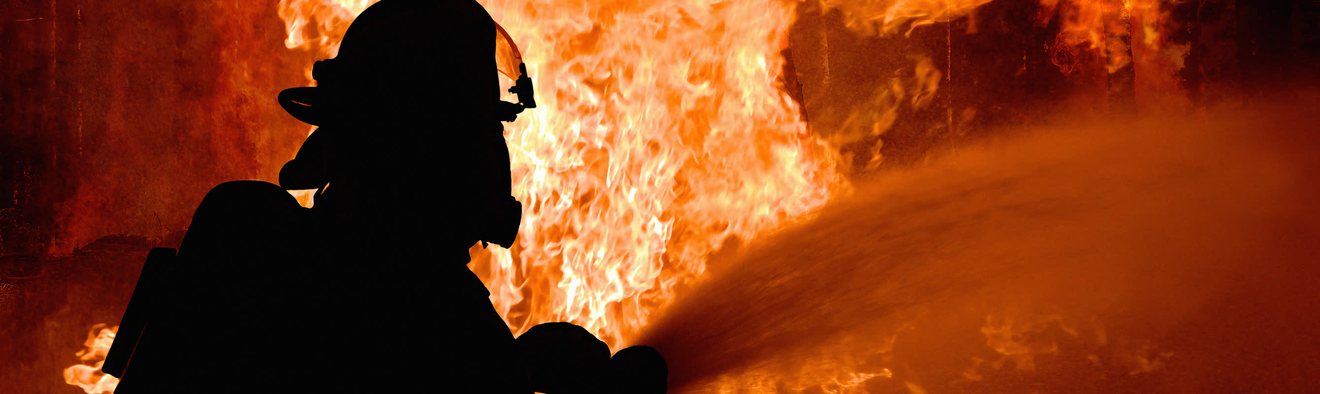 firefighter extinguishing flames