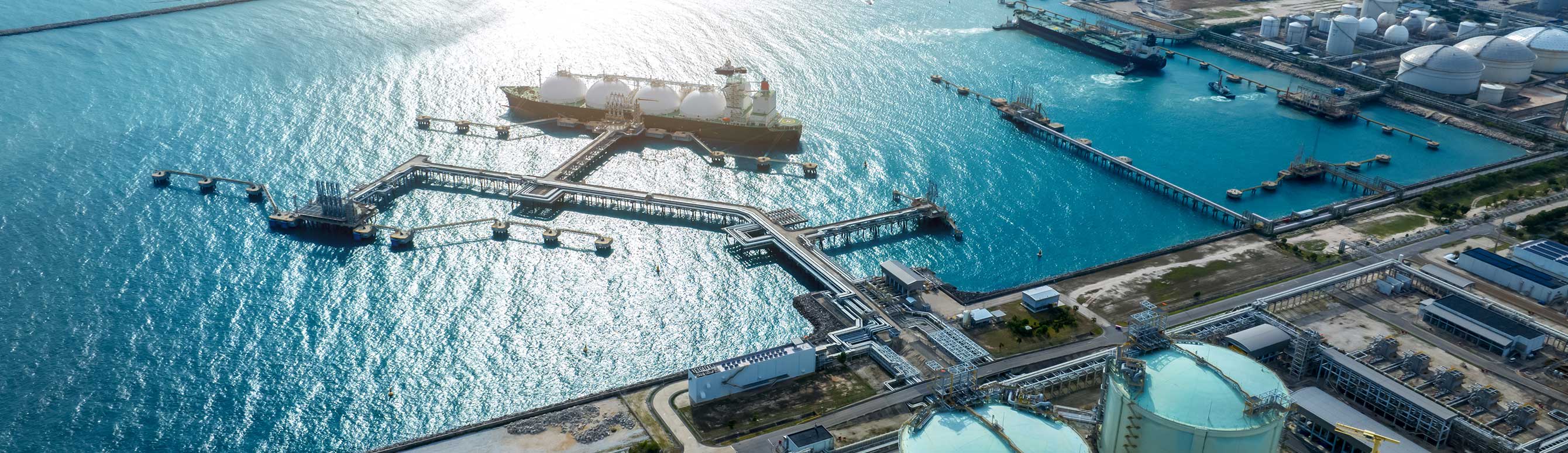 LNG (Liquified Natural Gas) tanker anchored in Gas terminal gas tanks for storage