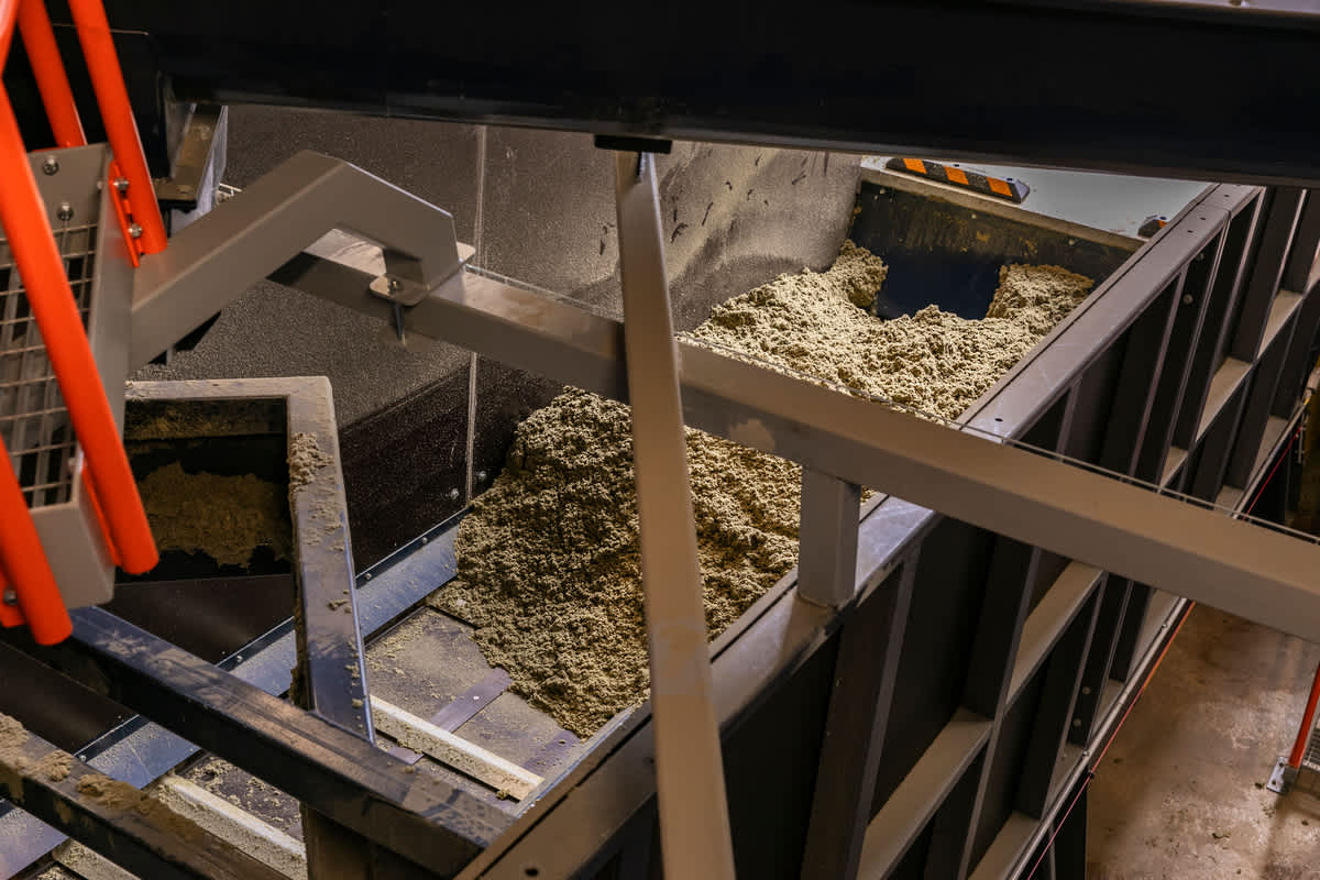 crushed stone wool on the conveyor at OC Paroc Parainen factory waste handling station..