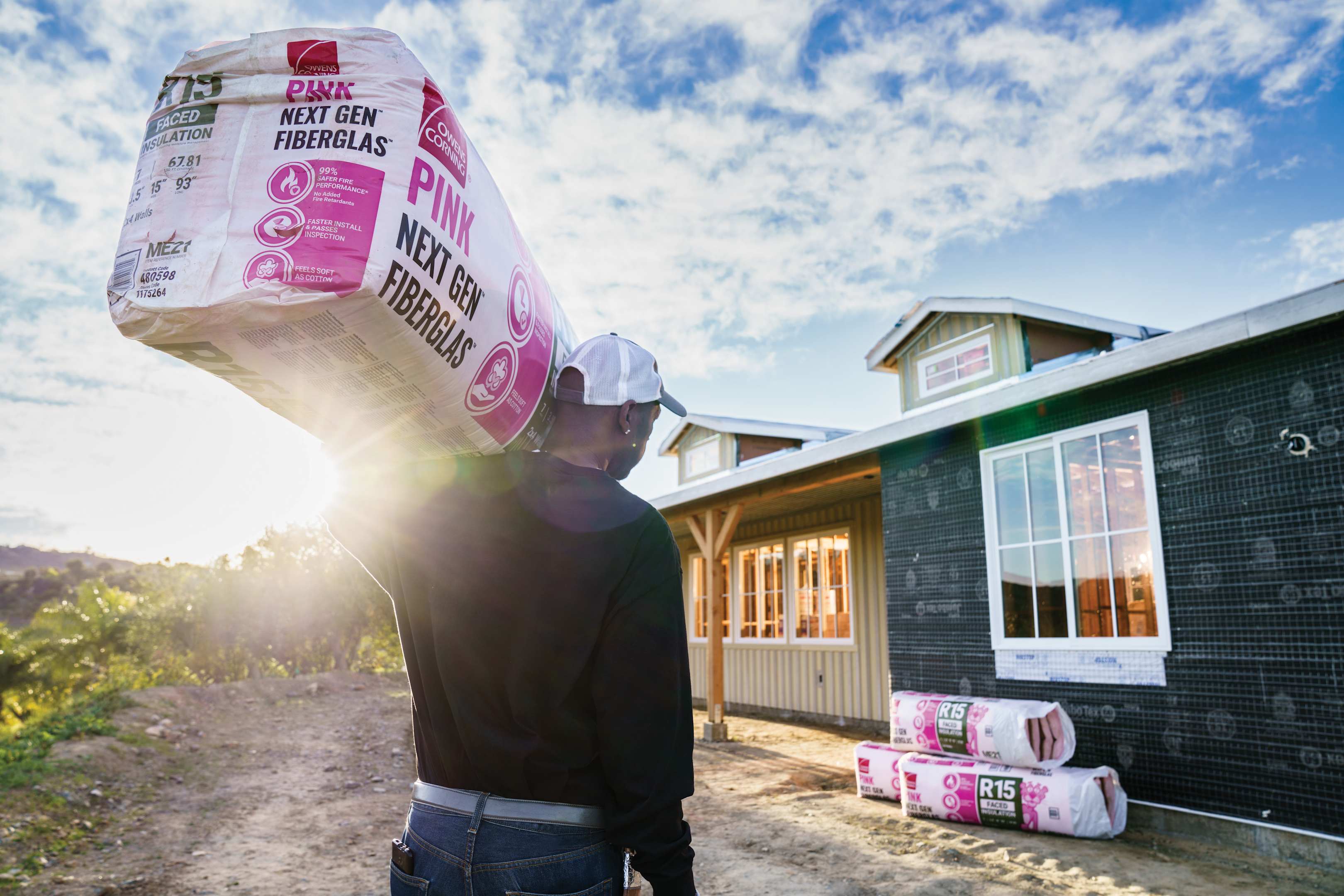 Man holding PINK® Next Gen® Fiberglas®