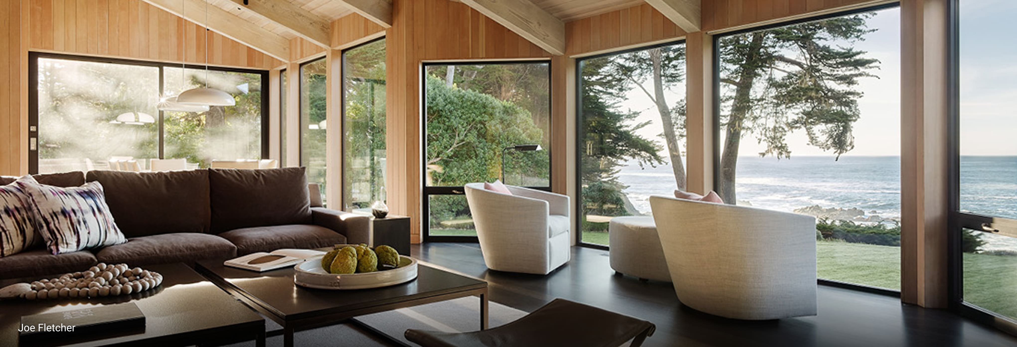 Fleetwood lifetime warranty document detailing coverage for anodized finishes, painted finishes, hardware components, and insulated glass, displayed on a gray textured surface.