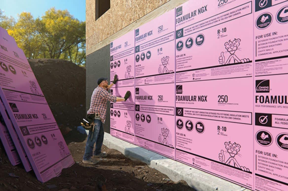 Contractor installing Foamular wall insulation.