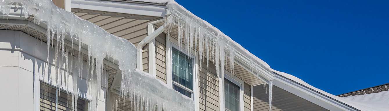 An ice dam is a ridge of ice that forms at the edge of a roof and prevents melting snowfrom draining off the roof.