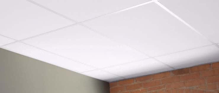 Ceiling tiles laid within the ceiling of a room.