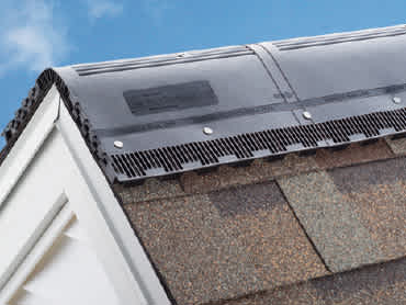 Closeup photo of VentSure® Sky Runner LTE® on a roof with blue sky in the background