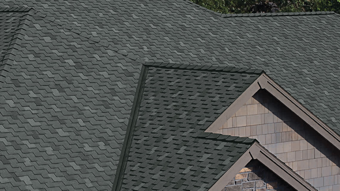 Photo of a gray roof with DecoRidge® Hip & Ridge Shingles installed