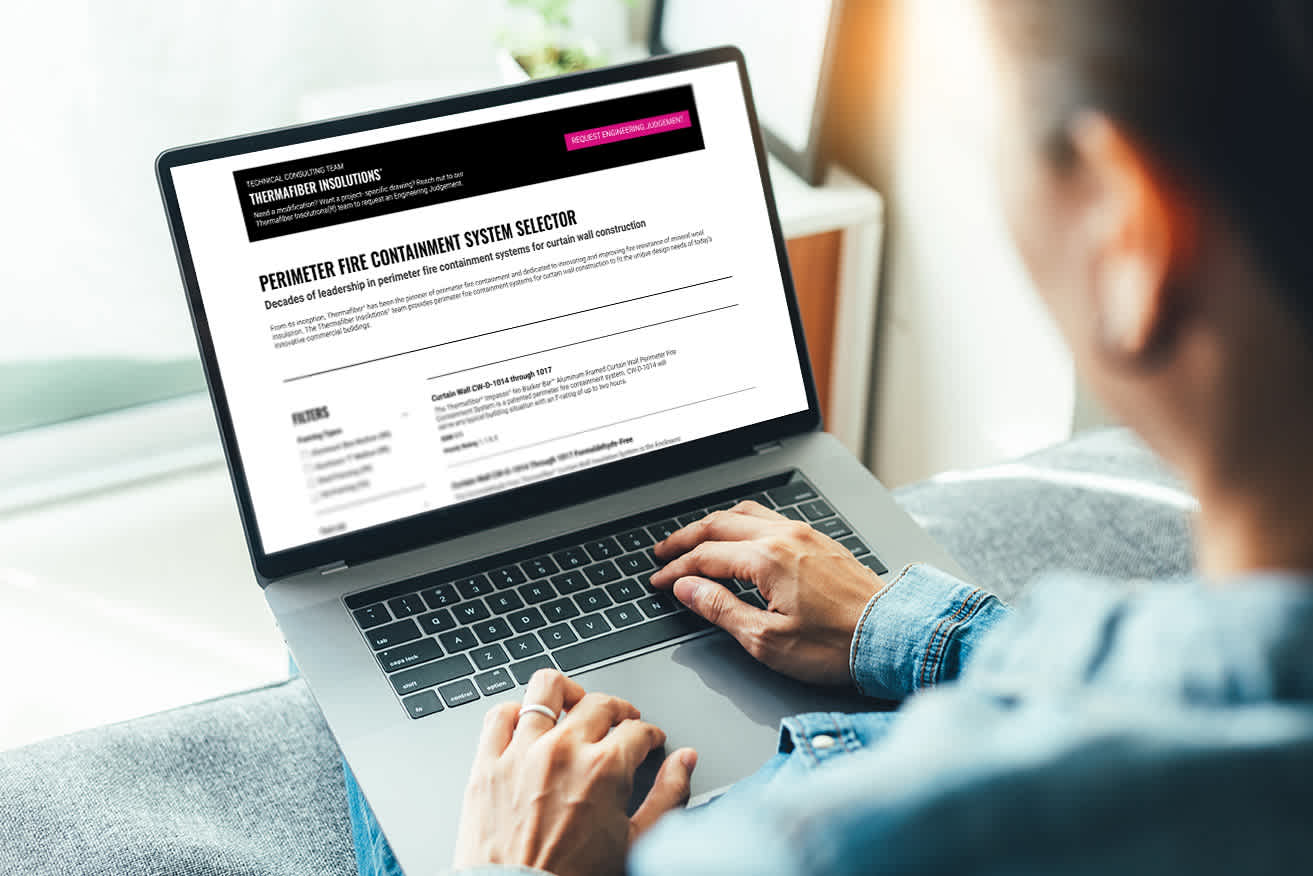 Person using a lap top to view the Perimeter fire containment system selector