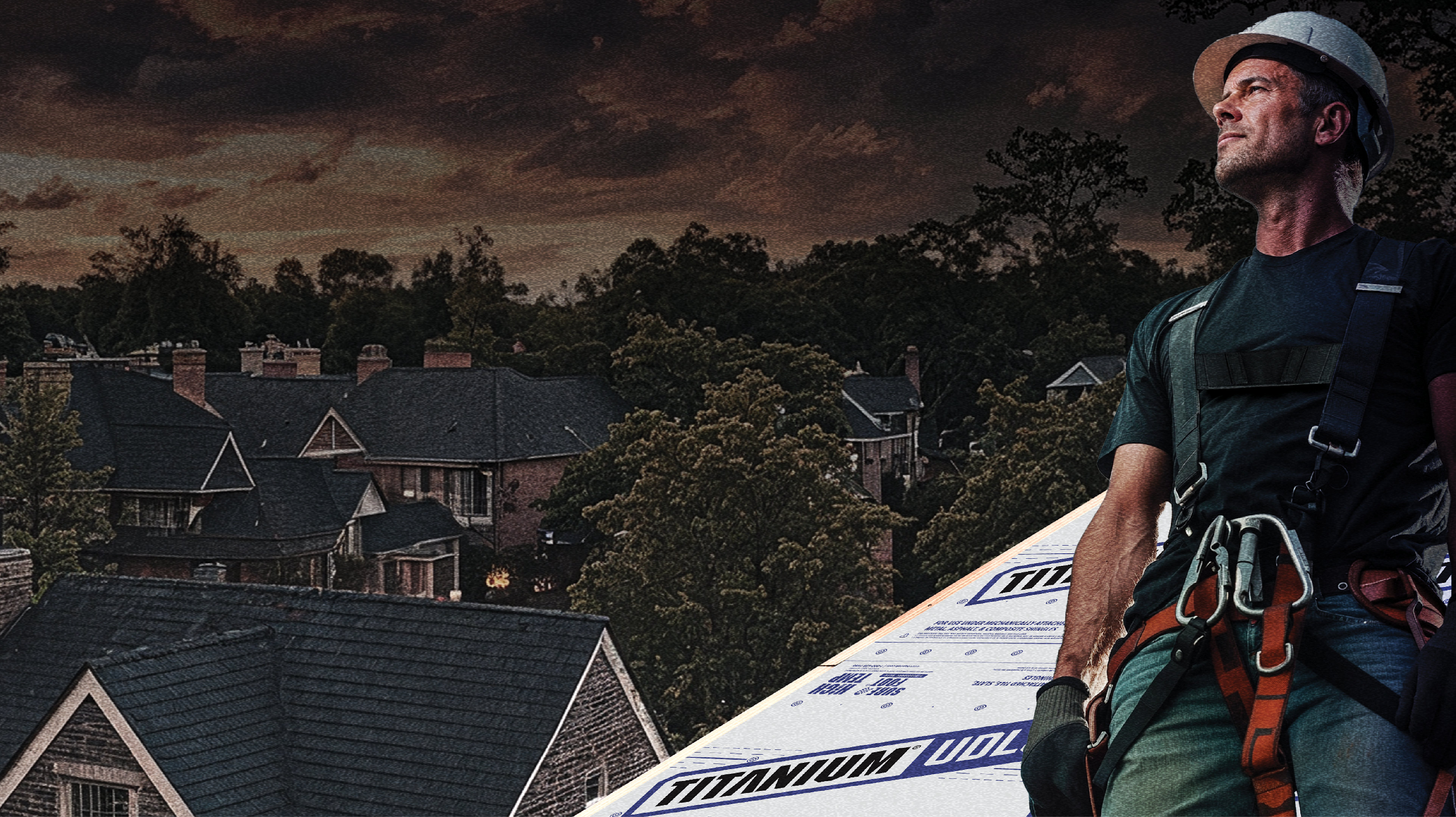 Photo of a contractor on a roof with Titanium® UDL50 Synthetic Roofing Underlayment